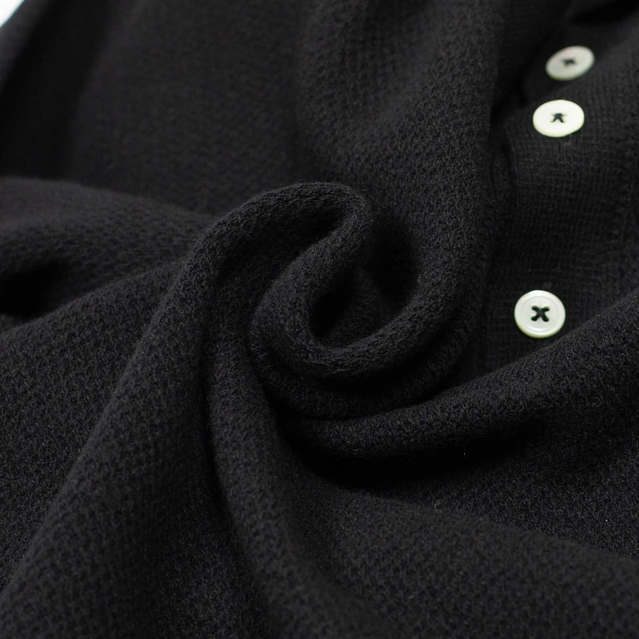 Molded knit long sleeve polo in micro-honeycomb black melange wool