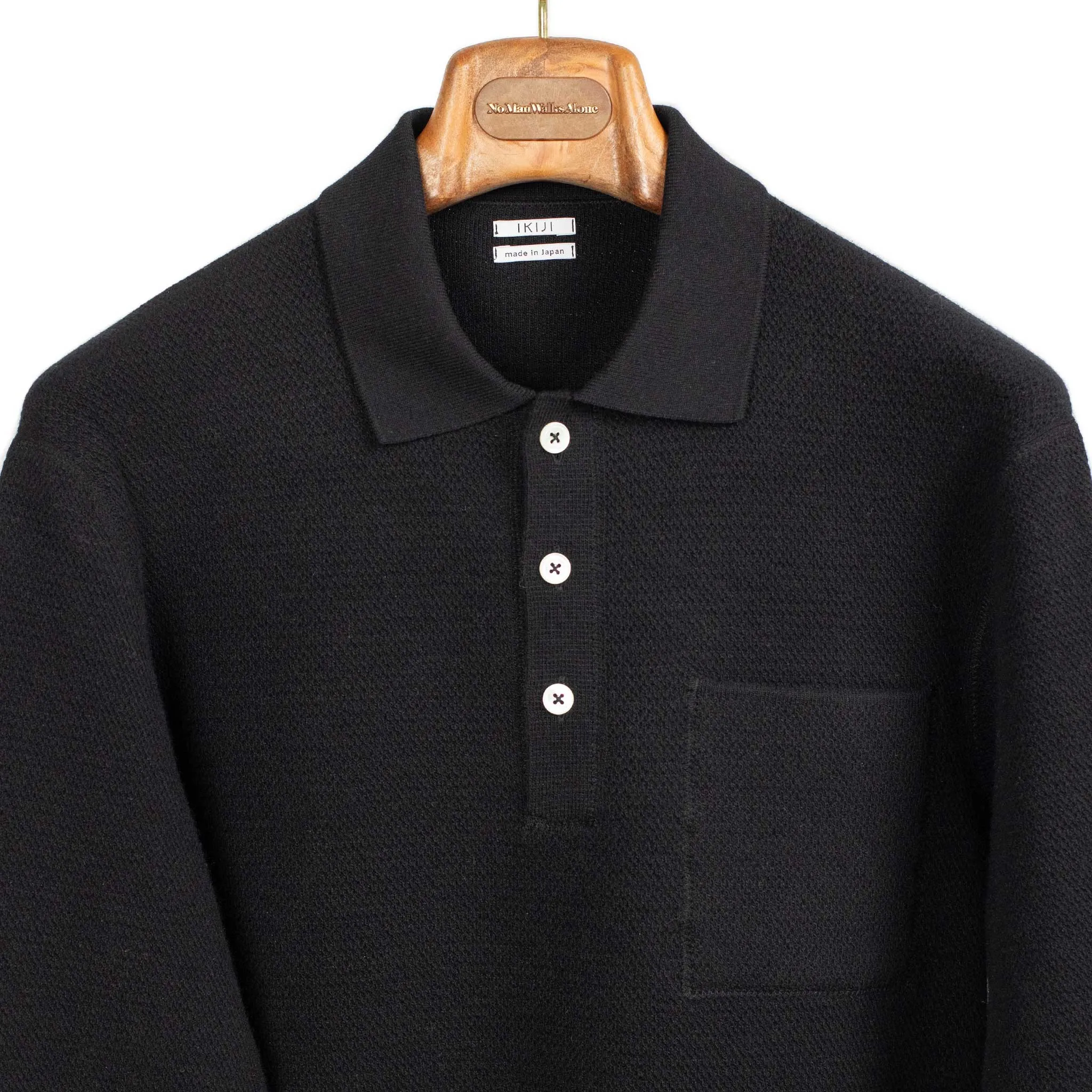 Molded knit long sleeve polo in micro-honeycomb black melange wool