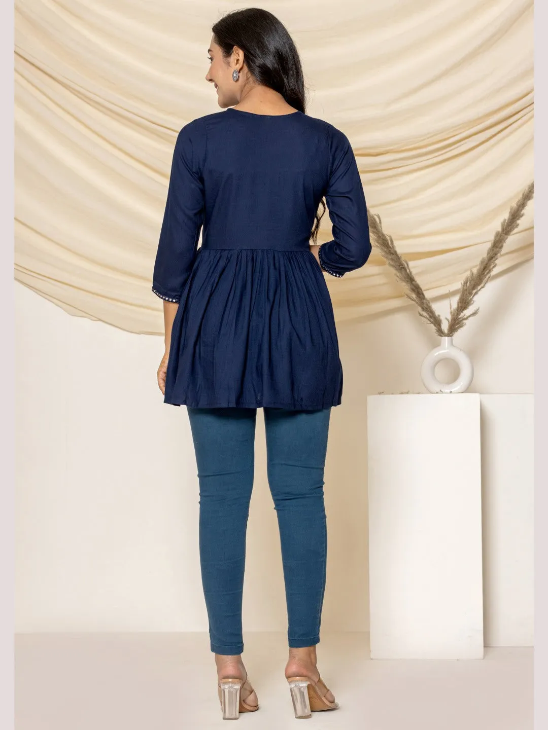 Solid Embroidered Peplum Top - Navy