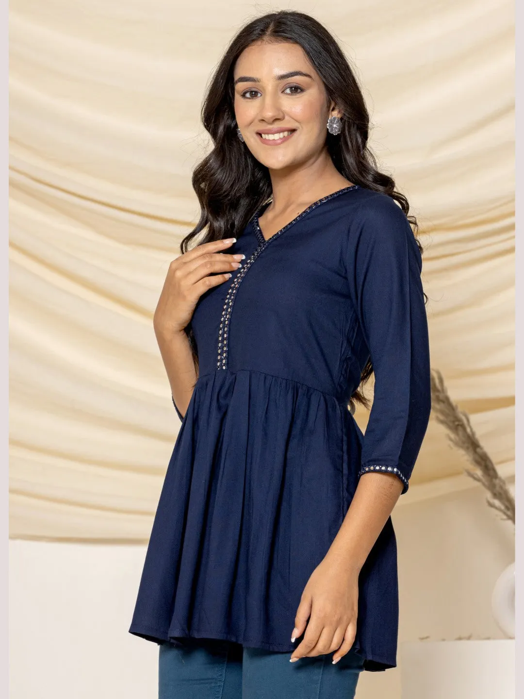 Solid Embroidered Peplum Top - Navy